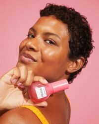 Female model holding Glow Recipe Guava Vitamin C Dark Spot Serum