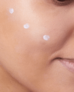 applying CeraVe Hydrating Mineral Sunscreen on face