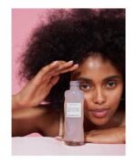 women holding Glow Recipe Watermelon Glow PHA + BHA Pore-Tight Toner