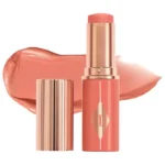 Charlotte Tilbury Unreal Lip + Cheek Glow Blush Stick with Hyaluronic Acid Rosy Glow - poppy peach in pakistan