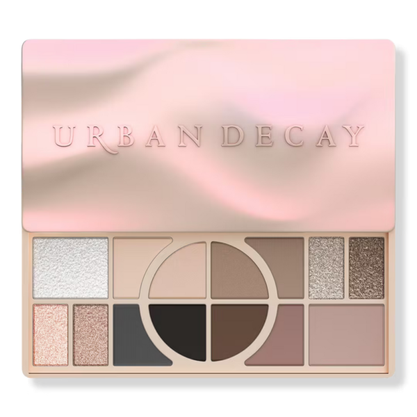 Urban Decay Naked Shaped Multi-Tasking Palette in Cool showing its wavy pink-gold metallic case and open 14-shade layout - Glamit.pk