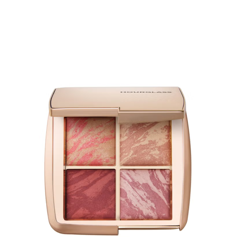 Hourglass Ambient Lighting Edit Flushed Edit 4-pan compact palette sitting open beside other luxury cosmetics - Glamit.pk