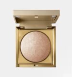 Stila Heaven's Hue Highlighter in shade Kitten open in its elegant gold compact showcasing the soft-focus champagne shimmer - Glamit.pk