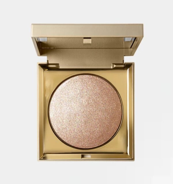 Stila Heaven's Hue Highlighter in shade Kitten open in its elegant gold compact showcasing the soft-focus champagne shimmer - Glamit.pk