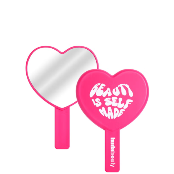 Original Huda Beauty Heart Shaped Hand Mirror in hot pink displayed for sale on GLAMIT PK