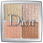 An open DIOR Backstage Glow Face Palette 002 showcasing four shimmery highlighter and blush shades embossed with the Dior logo on a mirrored surface with a makeup brush, available on GLAMIT PK.